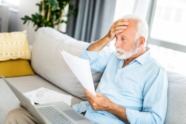 istock Worried mature man having bills to pay. 1267633242