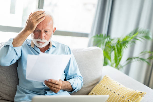 istock Worried mature man having bills to pay. 1267633249