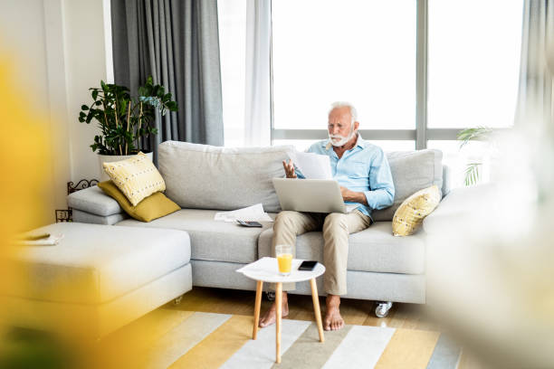 istock Displeased mature man having bills to pay. 1267633313