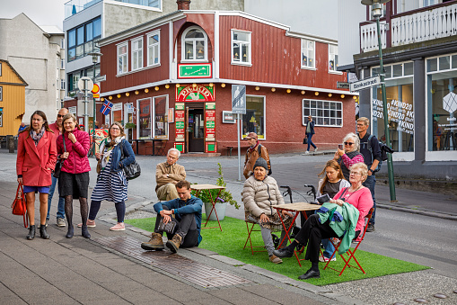 Reykjavik, Iceland, July 16, 2020: Group of people enjoying a small concert in the pedestrian street in the center of Reykjavik, the capital of Iceland.