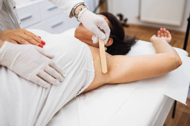 istock Woman receiving epilation treatment 1267640792