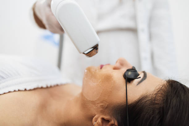 istock Woman receiving epilation treatment 1267640827