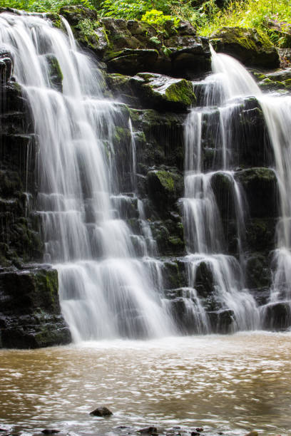 istock Hidden waterfall in a deep gorge with trickling white water. Forest of Bowland, Ribble Valley, Lancashire 1267641925
