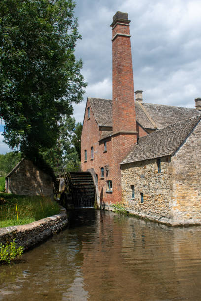istock Traditional English Watermill by small stream 1267646187