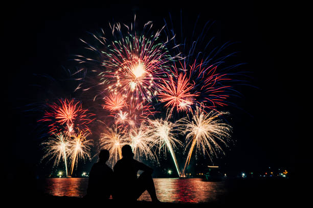 istock Couple enjoying Fireworks for New Year Celebration. 1267649605