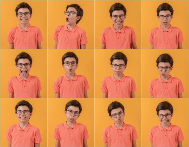 istock Happy schoolboy making different facial expressions. 1267650876