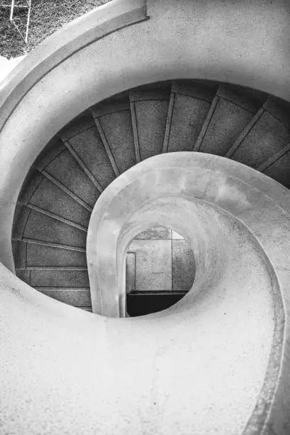 Photo of Spiral stairway top view in black and white color.