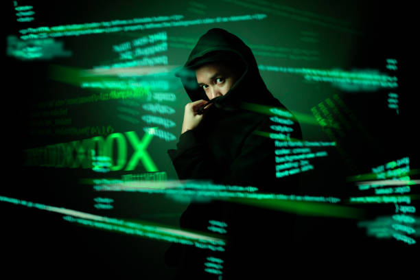 istock Hacker standing in the dark.Cybercrime concept. 1267652710