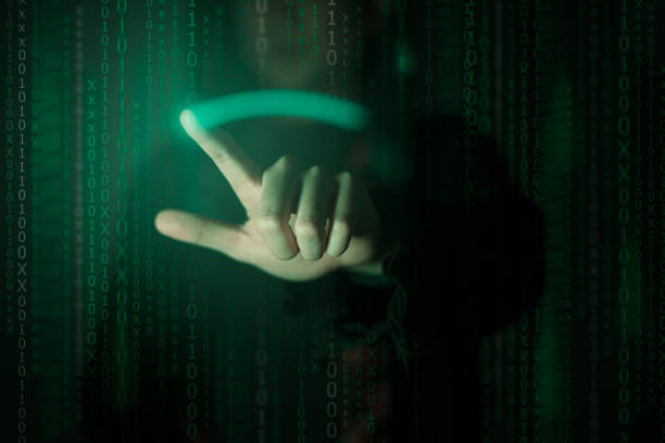 istock Hacker standing in the dark.Cybercrime concept. 1267652718