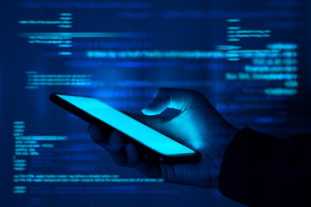 istock Hackers are stealing information, hand holds smartphone. 1267652721