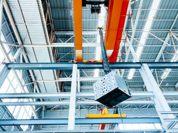 istock Overhead crane and machine inside factory building, industrial background. 1267652857