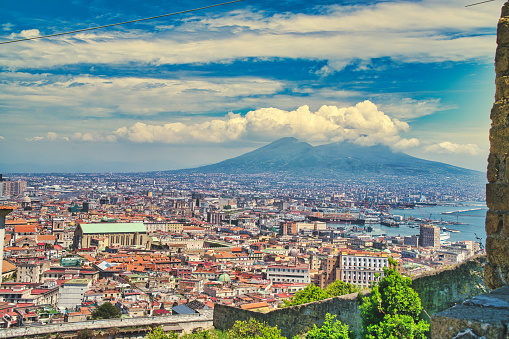 Looking over the city of Naples towards Mount Vesuvius in the background. Naples, Italian Napoli is the regional capital of Campania and the third-largest city of Italy, after Rome and Milan, with a population of almost 1million. It's the second-most populous metropolitan area in Italy and the 7th-most populous urban area in the European Union. In 1995, the historic center of Naples was listed by UNESCO as a World Heritage Site