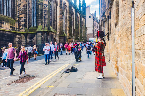 Edinburgh, UK - August 3, 2012: Scottish bagpipe player in the street on August 3, 2012 in Edinburgh, Scotland, UK