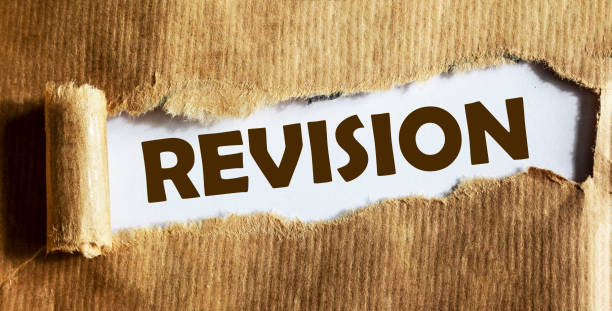 istock Revision text is written on torn brown paper 1267660122
