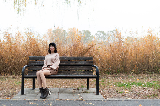 Beauty Girl Sitting on bench