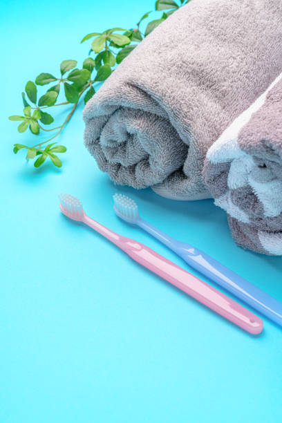 The toothbrushes, cup and towel The toothbrushes, cup and towel bad breath couple stock pictures, royalty-free photos & images