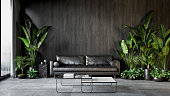 Black interior with sofa, plants and coffee table. 3d render illustration mock up.