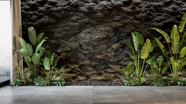 istock Black slate wall with plants. 3d render mock up illustration. 1267664020