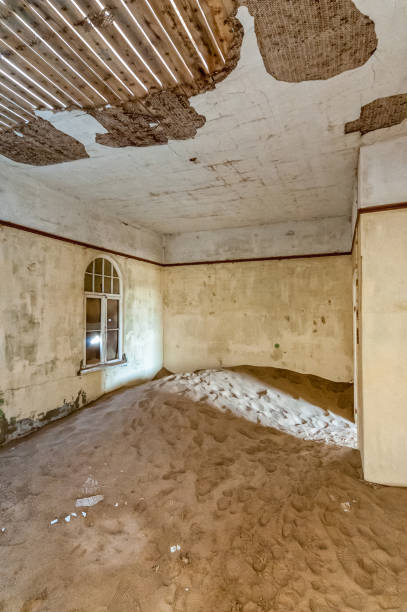 istock Decaying architecture at Kolmanskop, an abandoned diamond mining town 1267664156