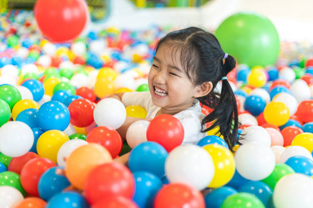 istock Cute girl at the Ball Pool 1267665156