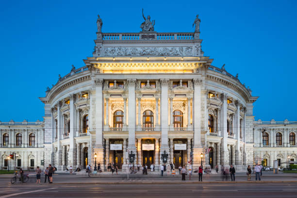Burgtheater in Vienna, Austria at Night, editorial Vienna - May 4: View of the Burgtheater in Vienna, Austria with night blue sky on May 4, 2018 burgtheater vienna stock pictures, royalty-free photos & images