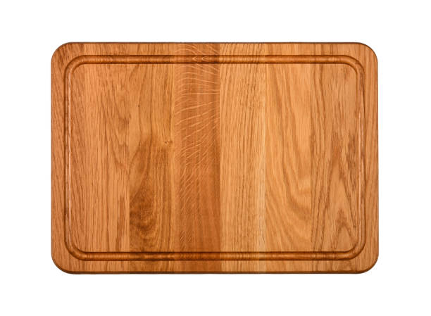 istock Oak wood cutting board isolated on white 1267669190