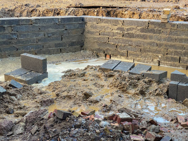 istock Rubble and standing water during landscape building work 1267671275