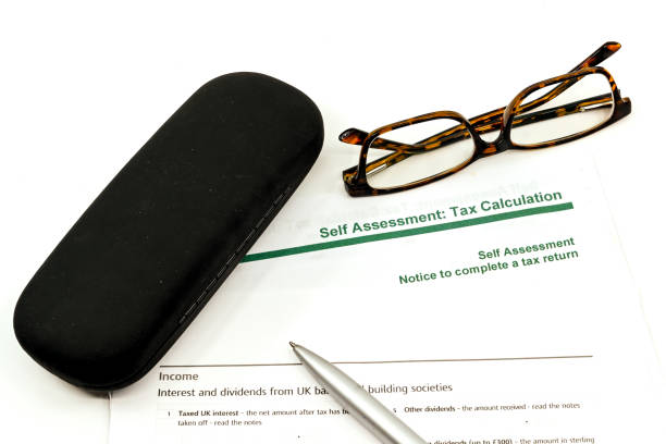 istock Tax form, pen, glasses and glasses case 1267672376