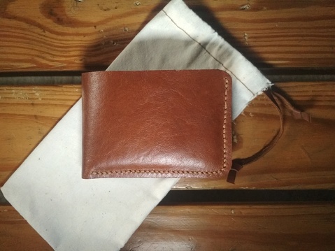 Brown leather wallet and withe pouch