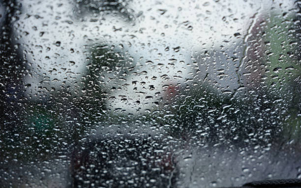 istock The rain drops seen through the windshield during the evening rain 1267674793