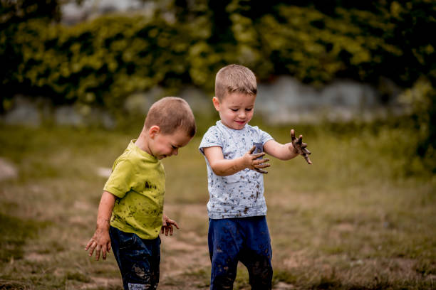 istock Happy child looking his muddy hands 1267675950