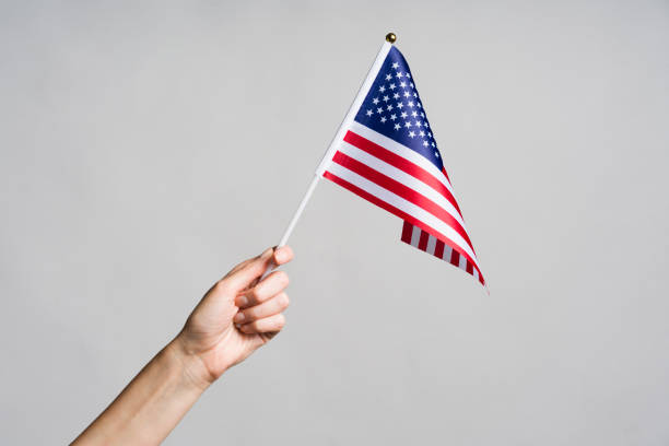istock Human hand holding USA flag 1267677525