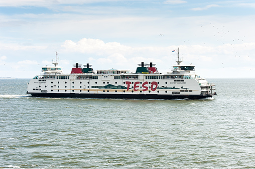 The Teso Ferry called Dokter Wagemaker leaves Texel into the Marsdiep strait between the island Texel and Den Helder. Texel is the largest Dutch island.