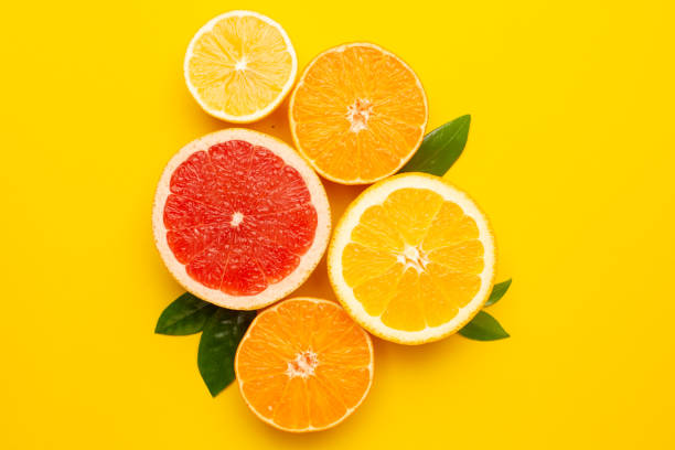istock Citruses fruits on yellow background with copyspace, fruit flatlay, summer minimal compositon with grapefruit, lemon, mandarin and orange 1267678368