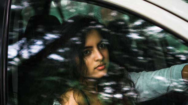 istock bold female model in car 1267678597