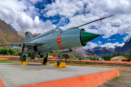 Kargil, Jammu and Kashmir,India - September 1ST 2014 : A MIG-21 fighter plane used by India to win in Kargil war 1999 (Operation Vijay), between Pakistan and India. Sky, mountain of Ladakh backgrond.
