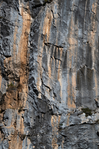 Close-up image of rock surface with heavy textured pattern and two tone colour