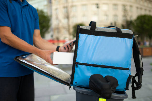 istock Young Caucasian delivery man delivering food 1267689533