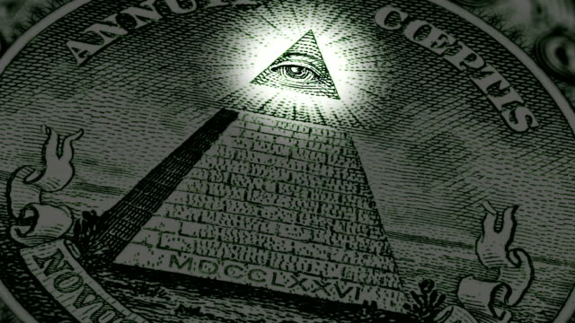 Fragment of the reverse side of one US dollar bill. Pyramid and Eye of Providence