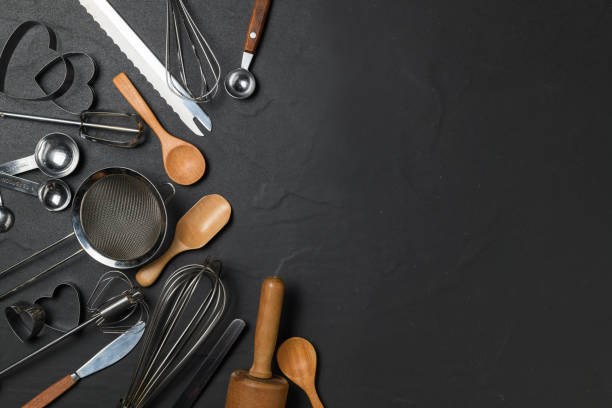 istock Kitchen utensils for pastries on black table and copy space, 1267690742