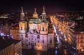 Prague old town square with St Nicholas Church and Pařížská at night – Czech Republic
