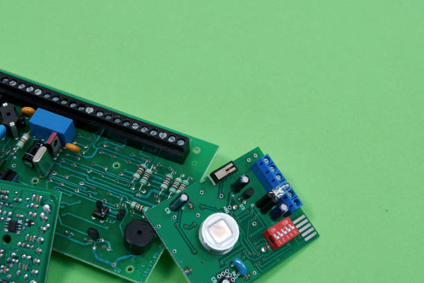 istock Electronic printed circuit boards on a green background. Recycling of electronic waste 1267691383
