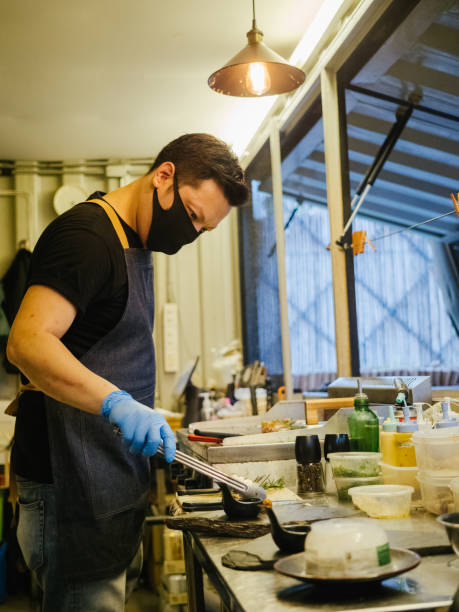 istock Asian business owner reopening a restaurant. 1267693363