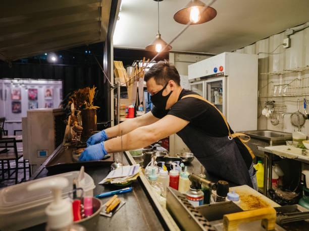 istock Asian business owner reopening a restaurant. 1267693382