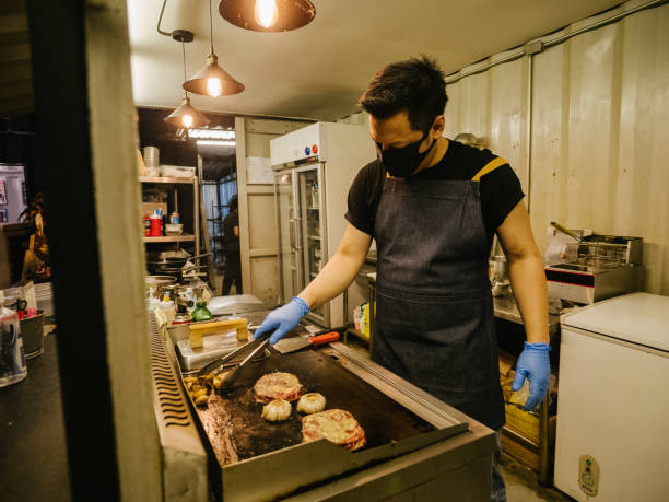 istock Asian business owner reopening a restaurant. 1267693450