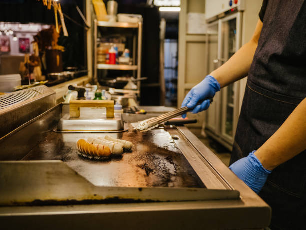 istock Chef cooking meat at professional kitchen. 1267694781