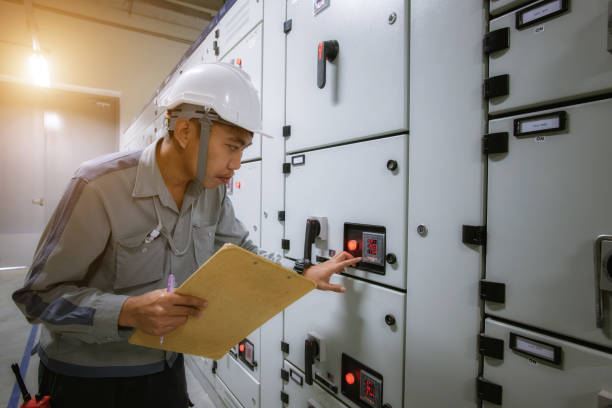 istock Electrical maintenance technician working for checking and monitoring status high voltage circuit breaker switchgear electrical distribution substation in the factory 1267695971