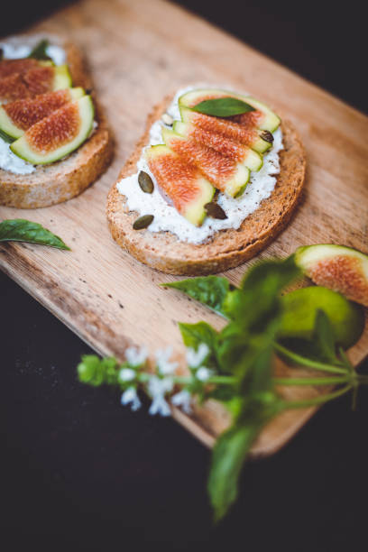 istock toasts with ricotta and figs on a wooden cutting board 1267697929