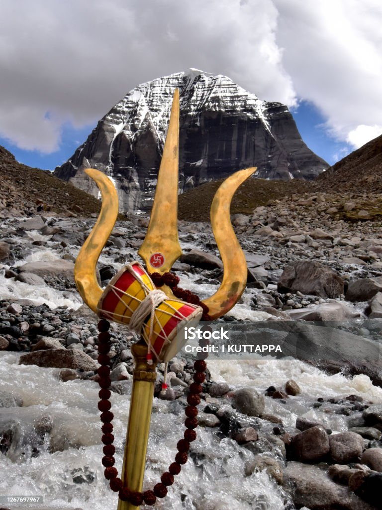 Mount Kailash A 6700 metre high mountain on the Tibetan plateau ,which is sacred to the Buddhist, Hindu , Jain and Bon religions. The mountain is revered by millions of Hindus, Buddhist and various Tibetan sects and is considered the abode of the great Hindu god Shiva Mt Kailash Stock Photo