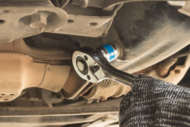istock Use screw for car engine maintenance service, Use 19 mm. Wrench to change engine oil. 1267699886
